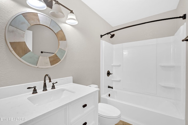 full bathroom with washtub / shower combination, toilet, and vanity