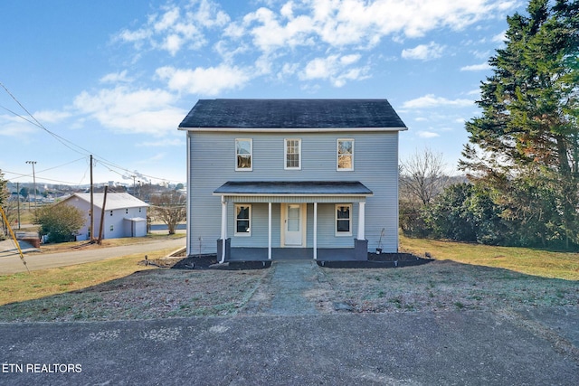 view of front of house featuring a porch and a front yard