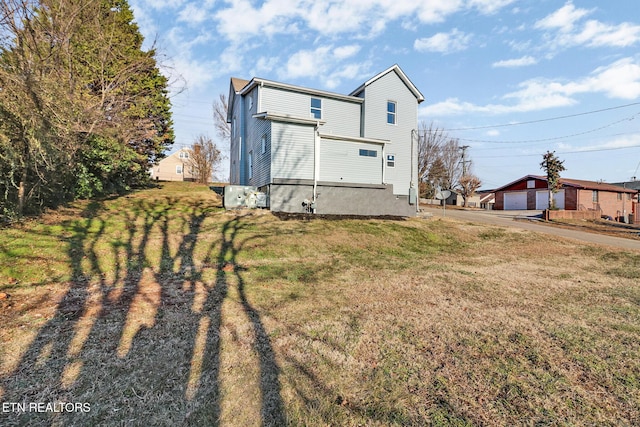 back of property with a lawn