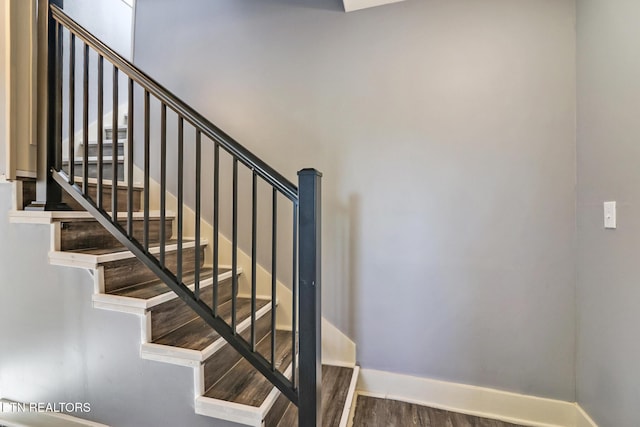 staircase featuring hardwood / wood-style flooring