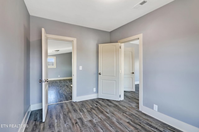 unfurnished bedroom featuring wood-type flooring