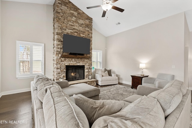 living room with high vaulted ceiling, a fireplace, dark wood finished floors, and baseboards