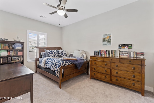 bedroom with ceiling fan, baseboards, visible vents, and light colored carpet