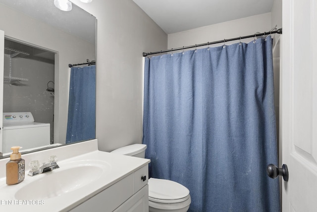 bathroom with washer / clothes dryer, toilet, and vanity