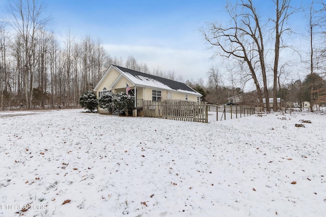 view of snow covered house