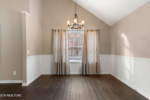 unfurnished dining area featuring dark wood-type flooring, vaulted ceiling, and a notable chandelier