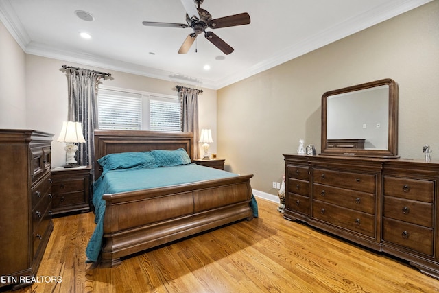 bedroom with ceiling fan, crown molding, and light wood-type flooring