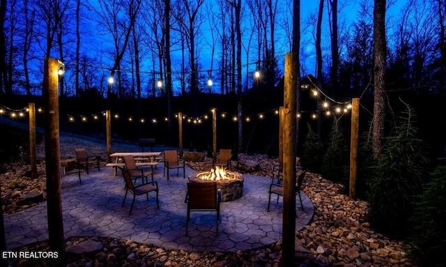 view of patio with a fire pit