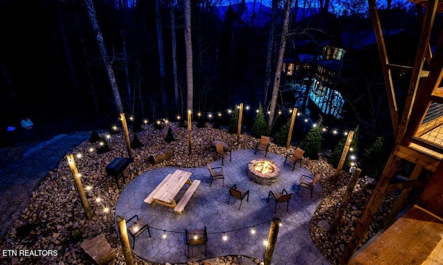 patio at twilight with an outdoor fire pit