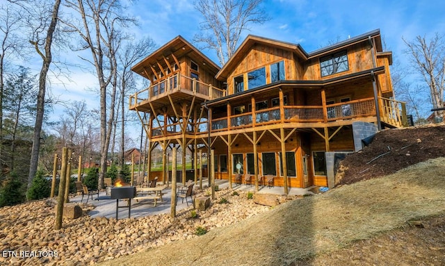 back of property with a patio area