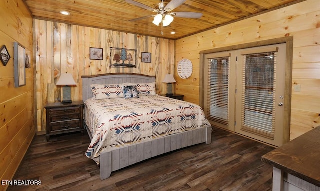 bedroom featuring wood ceiling, wooden walls, ceiling fan, dark wood-type flooring, and access to exterior