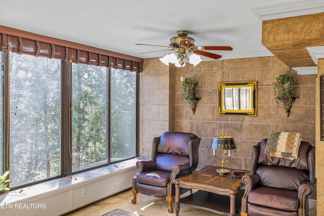 sunroom featuring ceiling fan