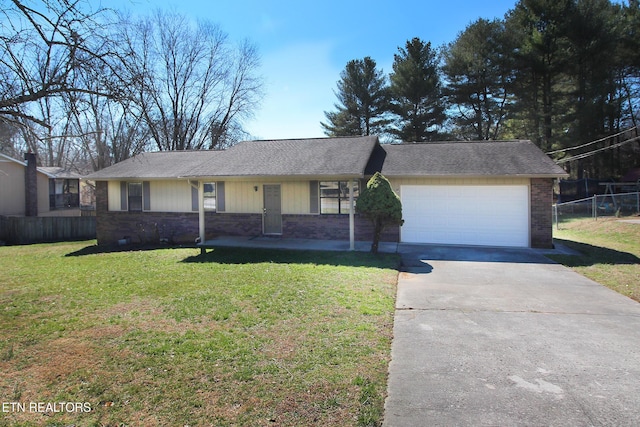 ranch-style house with a front lawn, an attached garage, fence, and brick siding