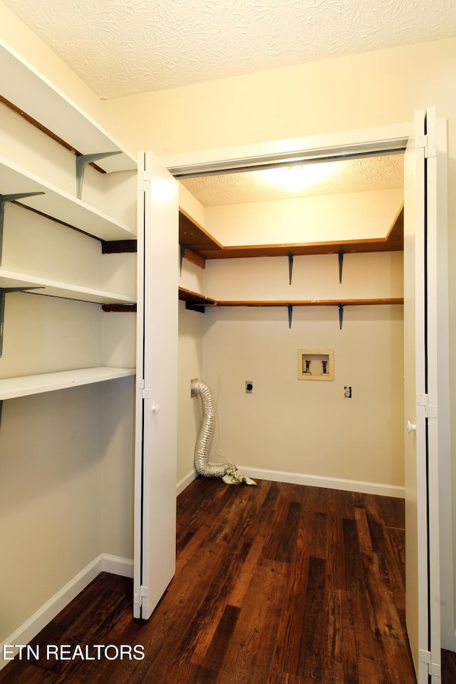 washroom with dark wood-style floors, laundry area, washer hookup, and electric dryer hookup