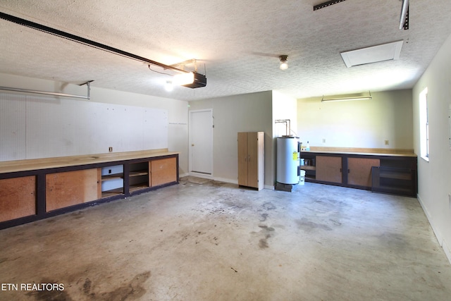 garage featuring a garage door opener, water heater, and baseboards