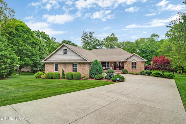 56 Westridge Ct, Fairfield Glade, TN 38558 - ranch-style home featuring a front yard, brick siding, and concrete driveway