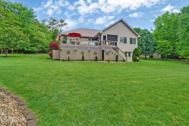 56 Westridge Ct, Fairfield Glade, TN 38558 - rear view of house featuring stairway, a deck, and a yard