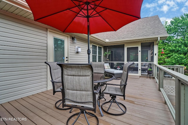 56 Westridge Ct, Fairfield Glade, TN 38558 - deck featuring a sunroom and outdoor dining space