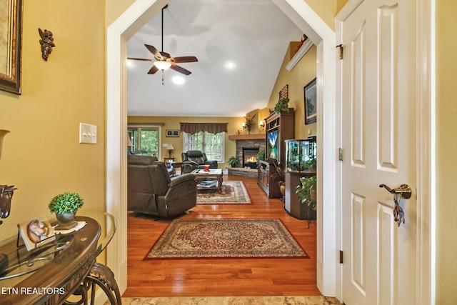 56 Westridge Ct, Fairfield Glade, TN 38558 - living room with a stone fireplace, a ceiling fan, wood finished floors, and lofted ceiling