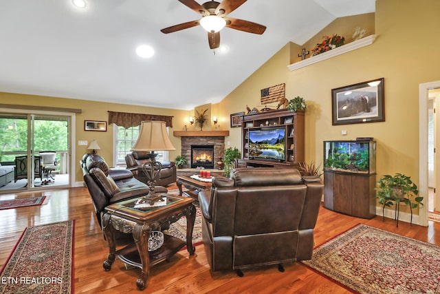56 Westridge Ct, Fairfield Glade, TN 38558 - living room featuring a fireplace, ceiling fan, vaulted ceiling, wood finished floors, and baseboards