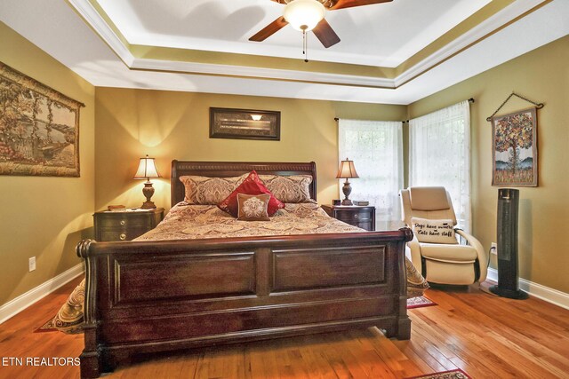 56 Westridge Ct, Fairfield Glade, TN 38558 - bedroom featuring a tray ceiling, wood-type flooring, and baseboards