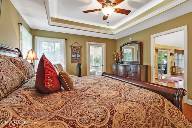 56 Westridge Ct, Fairfield Glade, TN 38558 - bedroom with a raised ceiling, wood finished floors, a ceiling fan, and ensuite bathroom