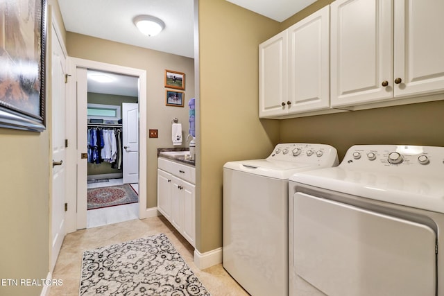 56 Westridge Ct, Fairfield Glade, TN 38558 - washroom with independent washer and dryer, cabinet space, light tile patterned floors, and baseboards