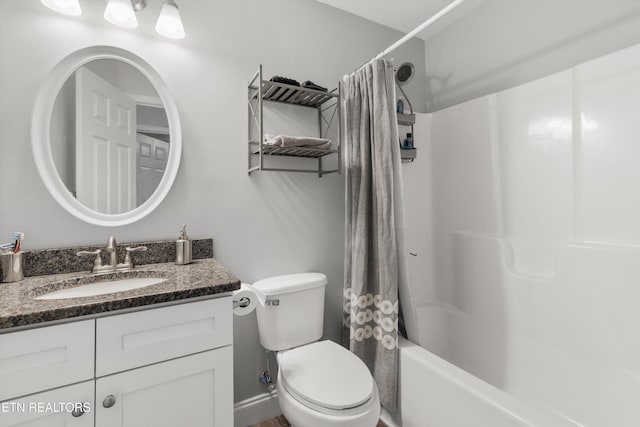 full bathroom featuring toilet, vanity, and shower / tub combo with curtain