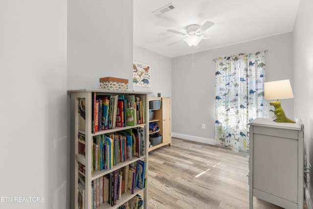 interior space with ceiling fan and light wood-type flooring