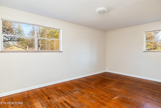 empty room featuring hardwood / wood-style flooring