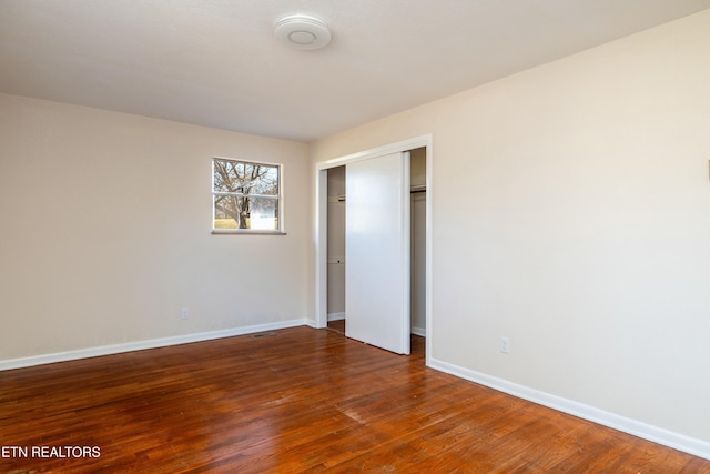 spare room featuring dark hardwood / wood-style floors