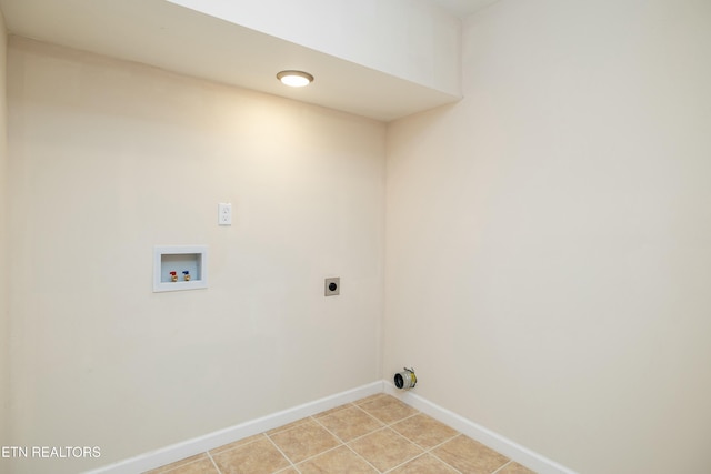 laundry room with light tile patterned floors, hookup for a washing machine, and hookup for an electric dryer