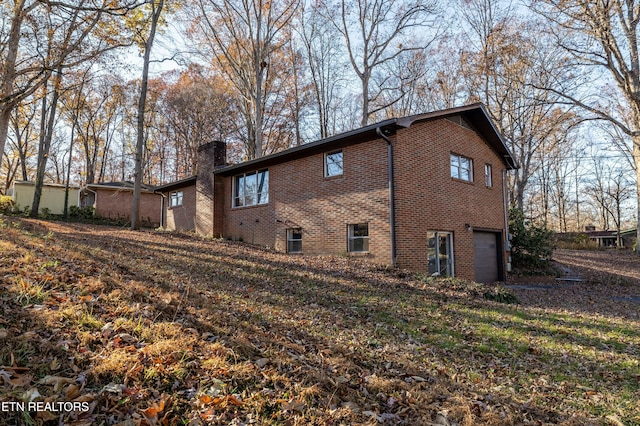 view of property exterior featuring a garage