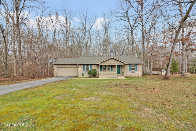 view of front of house featuring a garage and a front yard