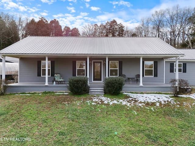 view of front of home with covered porch and a front yard