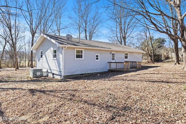 back of property featuring cooling unit and a wooden deck