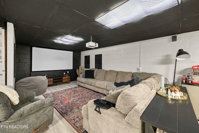 home theater room with hardwood / wood-style flooring