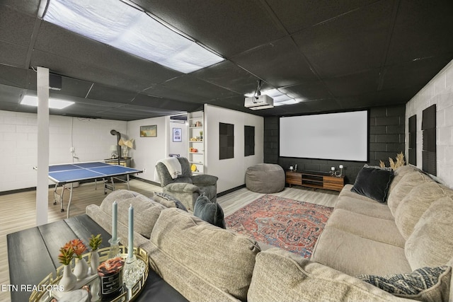 home theater featuring hardwood / wood-style flooring