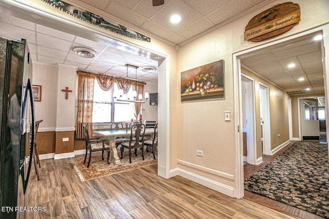 hall with hardwood / wood-style floors