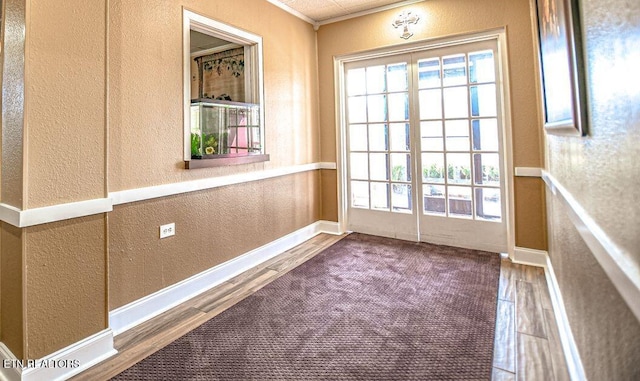 doorway to outside featuring hardwood / wood-style flooring