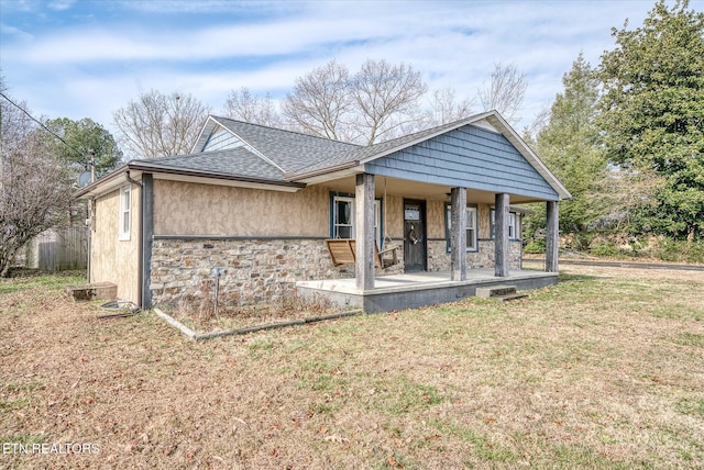 exterior space featuring a porch and a yard