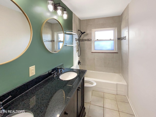 full bathroom with vanity, toilet, tile patterned floors, and tiled shower / bath combo