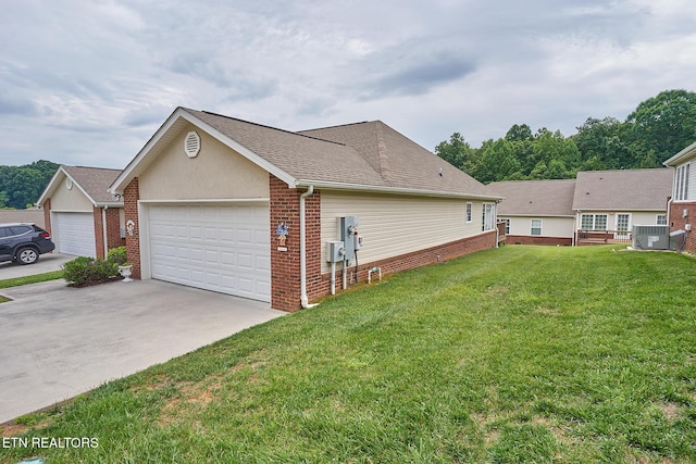 view of property exterior featuring central air condition unit, a yard, and a garage