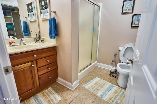 bathroom with toilet, walk in shower, vanity, and tile patterned flooring