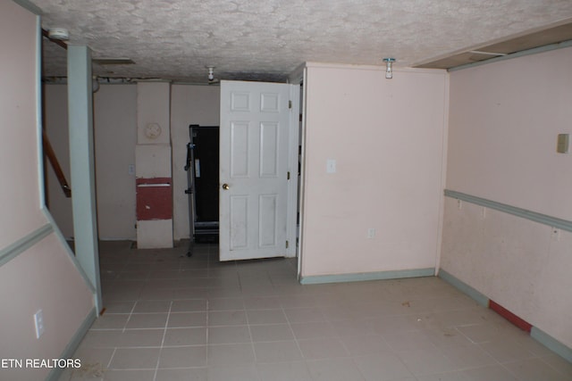 spare room featuring a textured ceiling