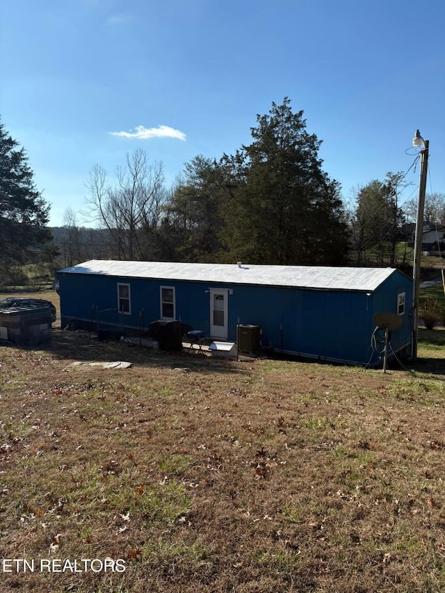 view of front of home with cooling unit