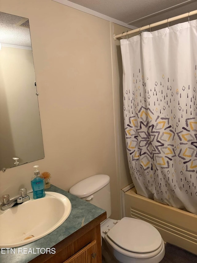 full bathroom featuring toilet, shower / bathtub combination with curtain, a textured ceiling, ornamental molding, and vanity