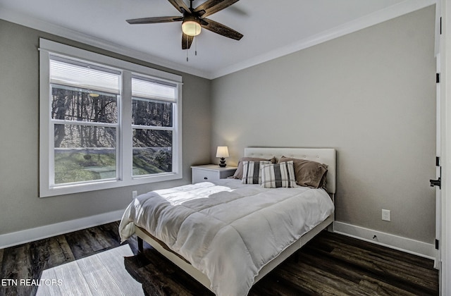 bedroom with dark wood-style floors, baseboards, ornamental molding, and ceiling fan