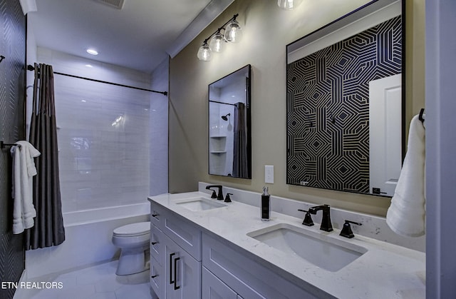 bathroom with double vanity, shower / tub combo, a sink, and toilet