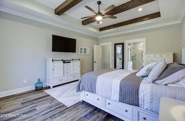 bedroom with ensuite bathroom, wood finished floors, a ceiling fan, baseboards, and beam ceiling